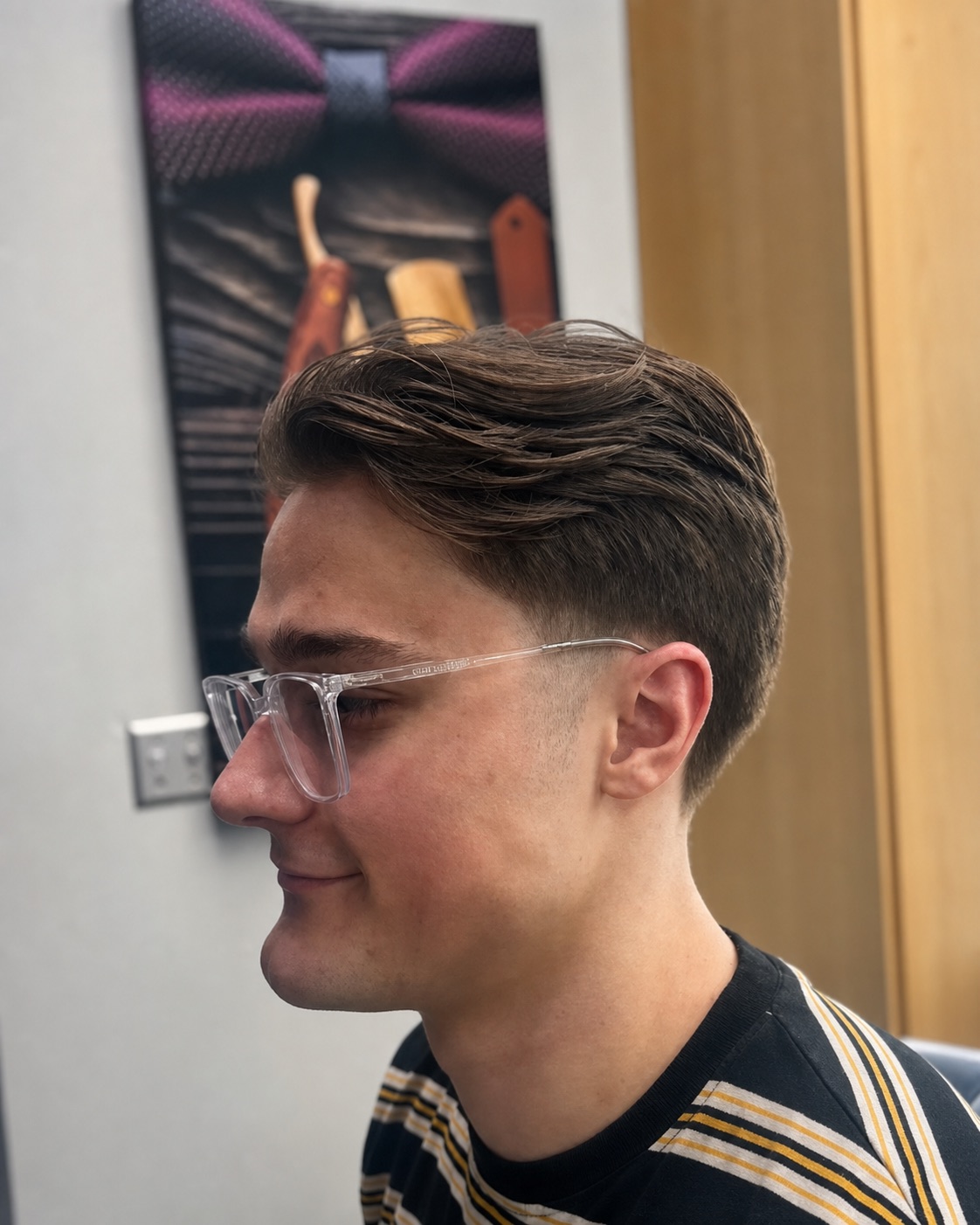 Classic tapered haircut styled by Moe