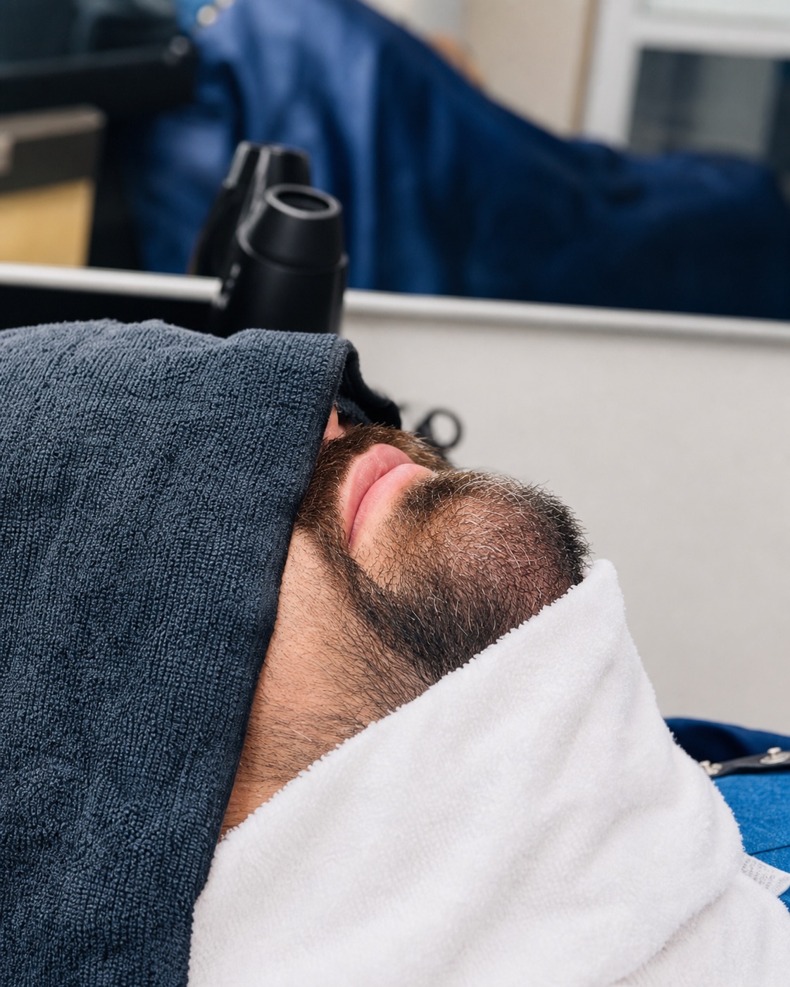 Hot towel beard grooming service at Moe's Hair Shop